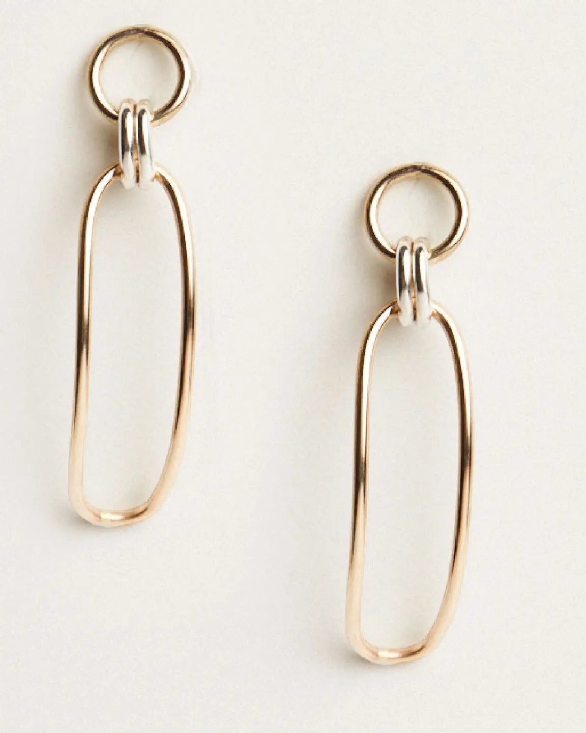 Close up photo of the Able Date Night Two-Tone Drop Earrings against a white background