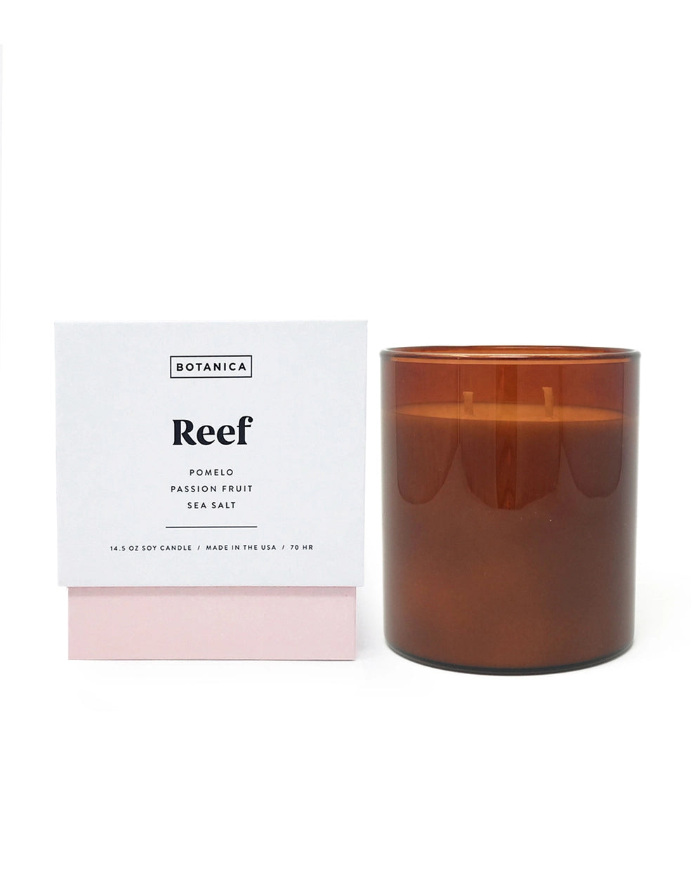 Photo of the Botanica Reef scent candle package next of the candle jar in front of a white background