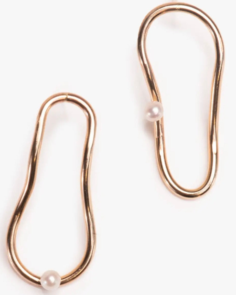 Close up photo of the Able Pearl Orbit Earrings in gold against a white background