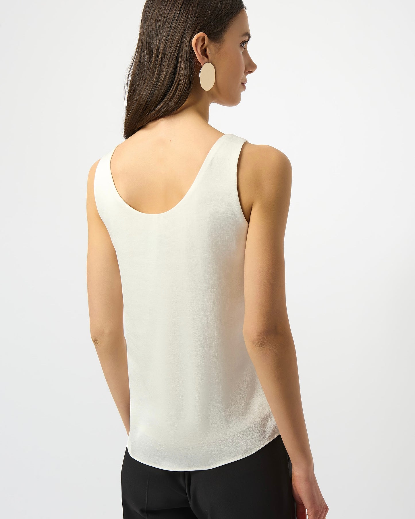 Model is wearing Joseph Ribkoff Recycled Hammered Satin Sleeveless Top in winter white on a white background