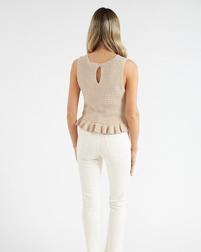 Model wearing Greylin Natural Fredi Crochet Tank wearing white pants on a white background