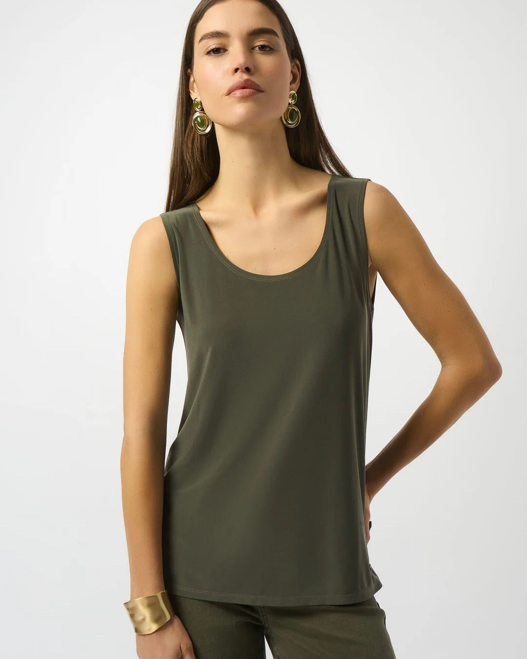 Model is wearing Joseph Ribkoff silky knit scoop neck camisole in color avocado on a white background