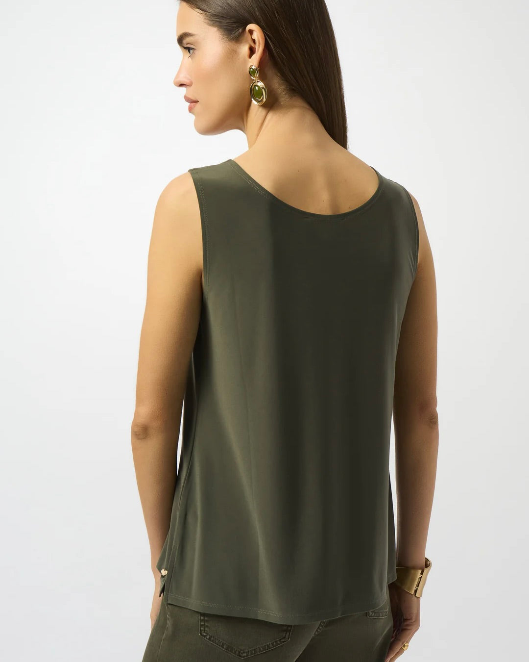 Model is wearing Joseph Ribkoff silky knit scoop neck camisole in color avocado on a white background