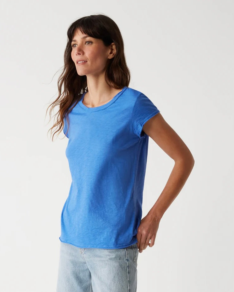 Model wearing Michael Stars salt water blue Trudy Crew Tee wearing jeans on a white Background