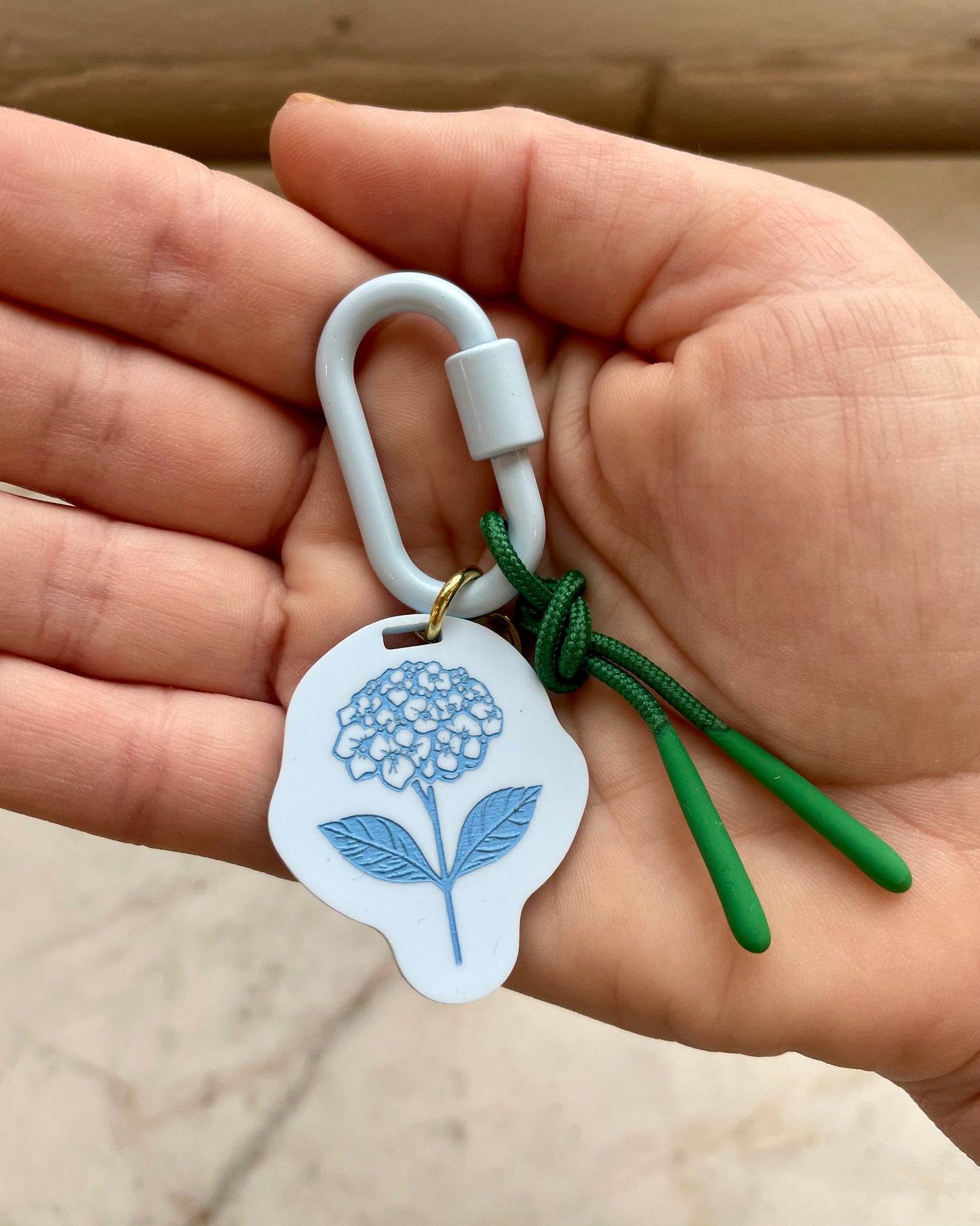 Freshwater curated goods Hydrangea Fish Carabiner Bag Charm in hand