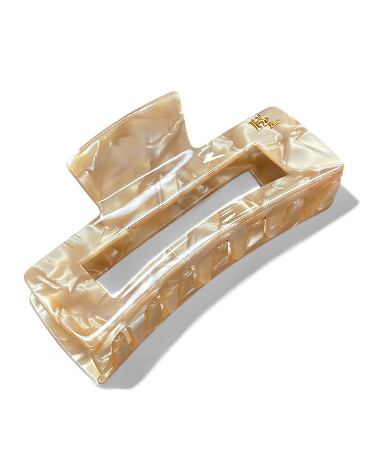 Beige HoneyLux hair clip on a white background