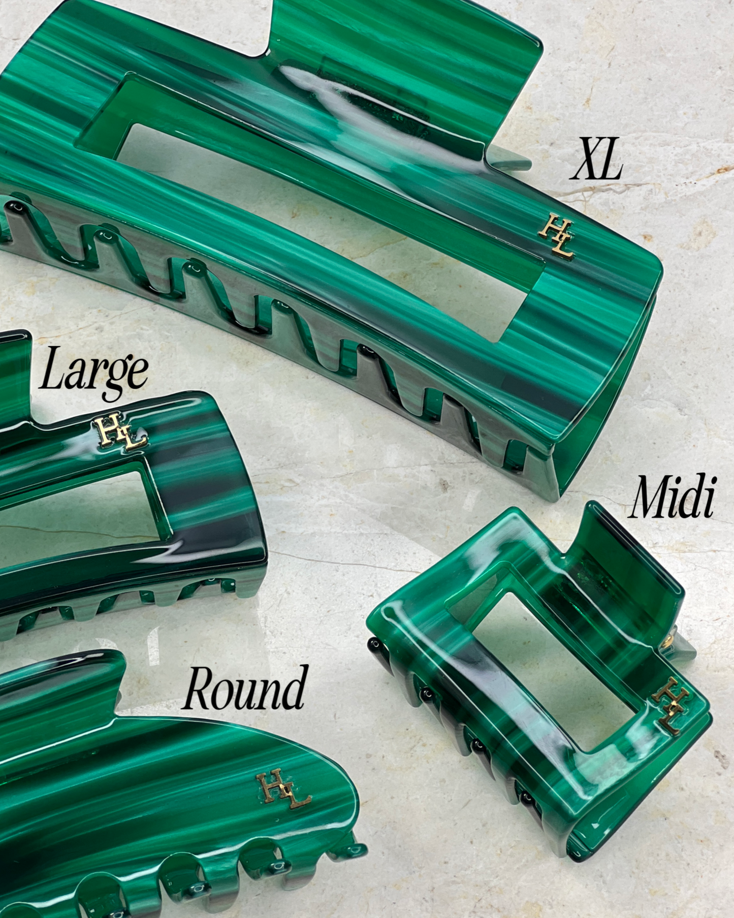 A set of the different HoneyLux in Ecofriendly Acetate Midi Clips in Emerald on a neutral background