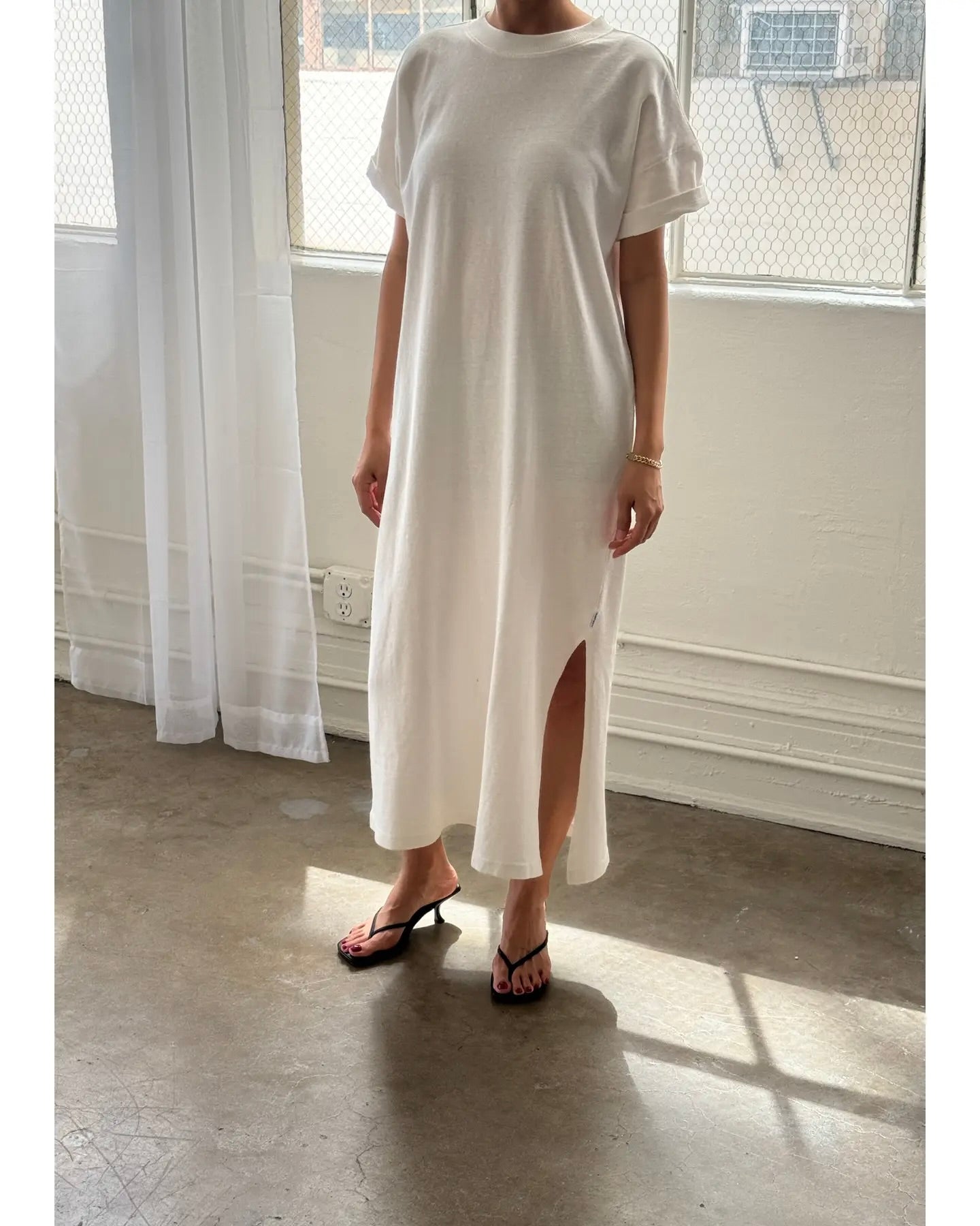 Front view of model wearing the Le Bon Shoppe Her Dress standing in front of a white wall