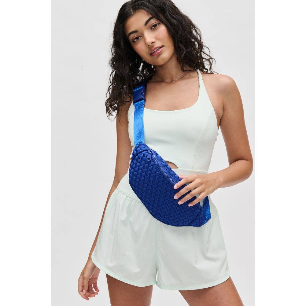 Model wearing Sol & Selene Aim High Woven Neoprene Belt Bag wearing white on a white background