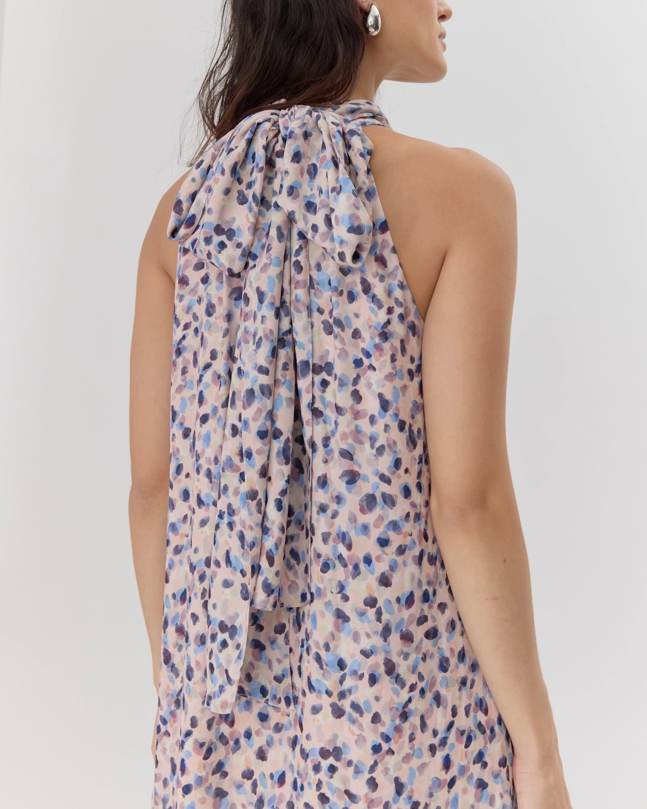 Back view of the Greyline Carina maxi dress on a model in front of a white background.