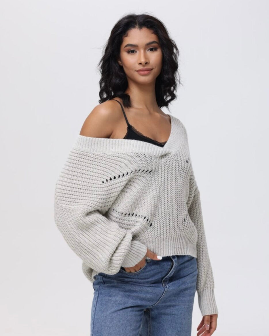 Model wearing 525 Lainey sweater in sea salt and denim on a white background