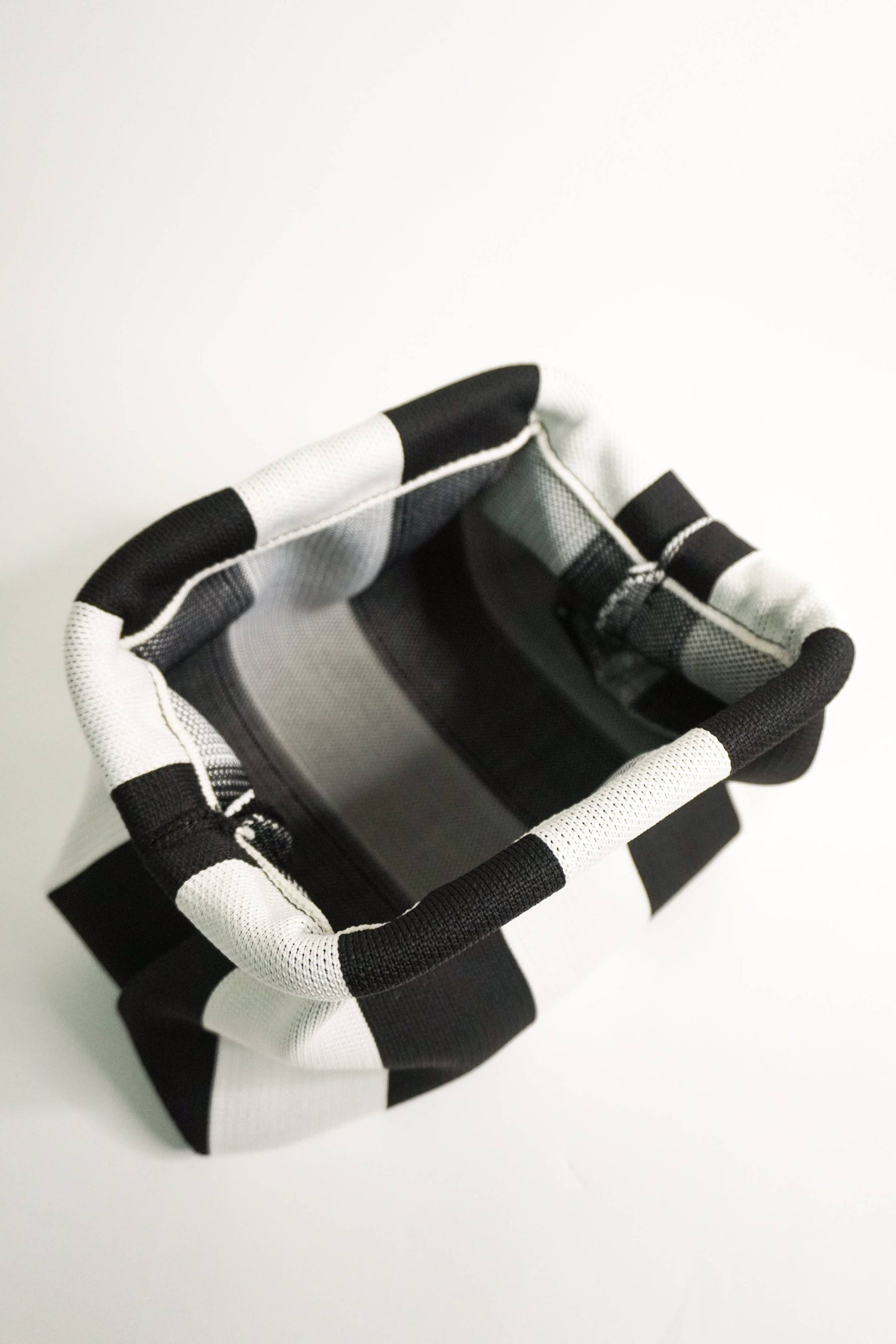Black and white open clutch on a white background