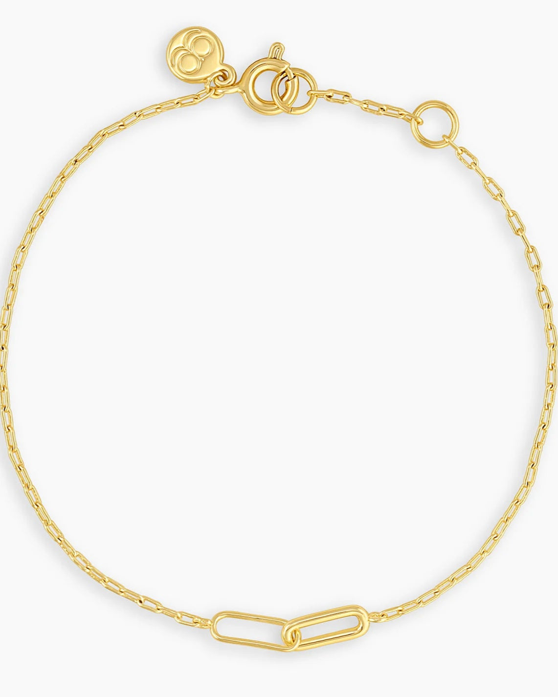 Gold chain bracelet with larger chains interlocking in the middle, against a white background.