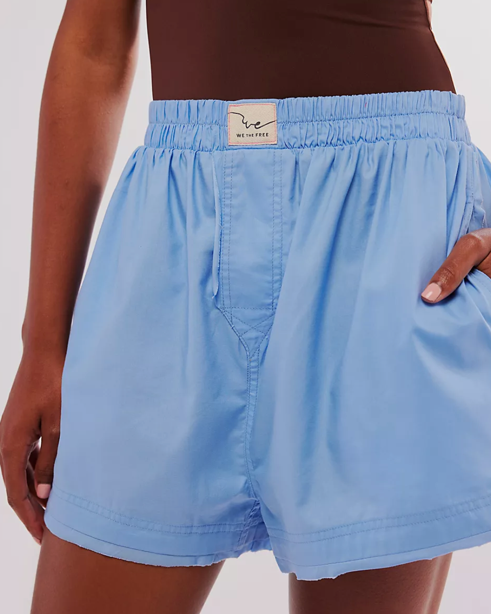 Front view of model wearing the Free People We The Free Day to Day Solid Boxers standing in front of a white wall.