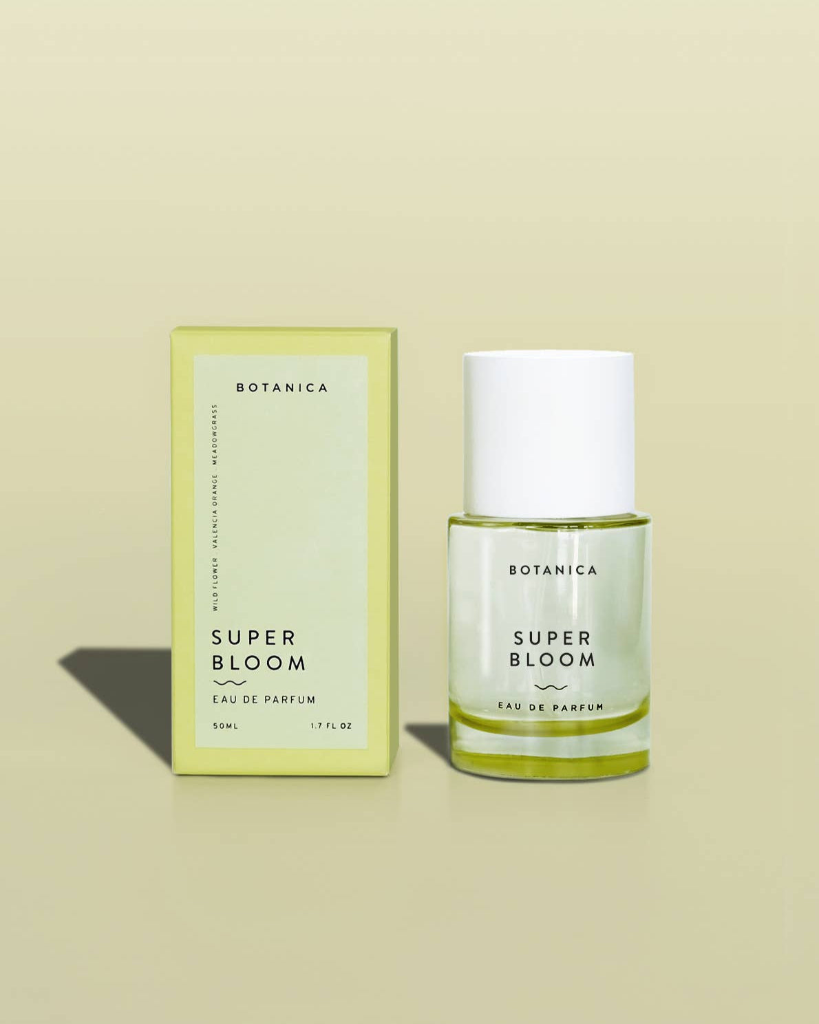 Botanica Super Bloom eau de parfum bottle and packaging on a beige background