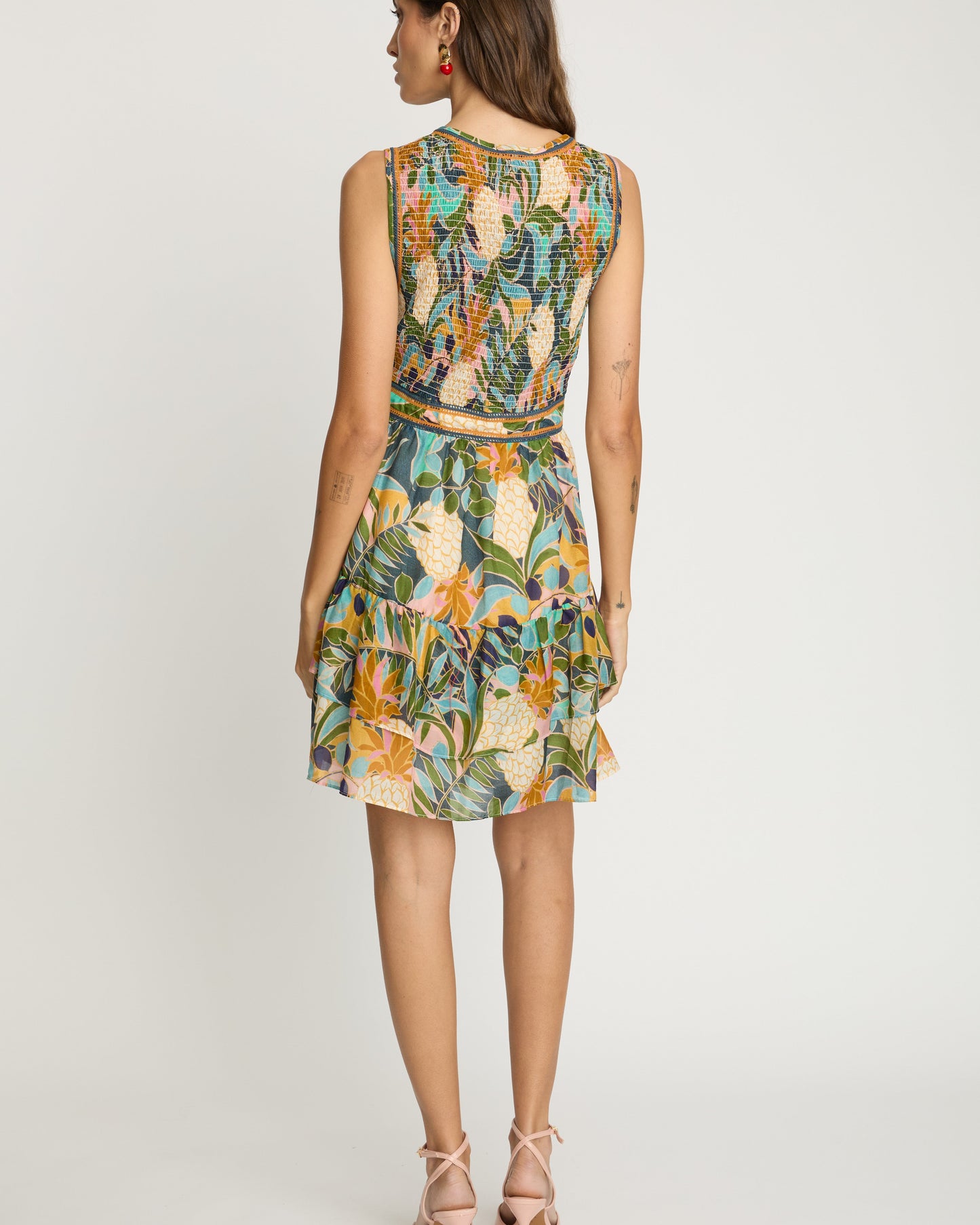 Woman wearing a floral dress on a white background