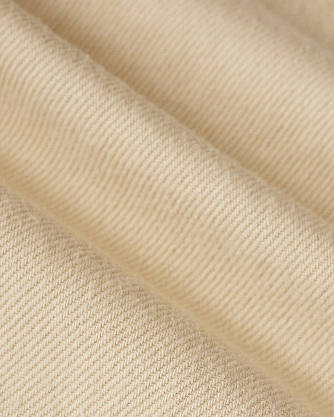Close-up of beige fabric with a textured pattern