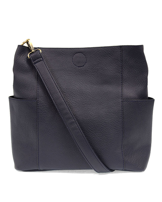 Navy vegan leather handbag with a shoulder strap on a white background