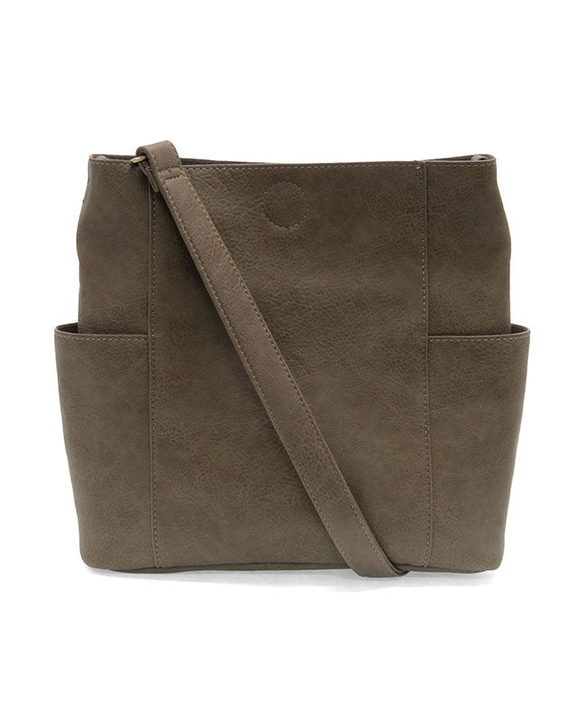Taupe vegan leather handbag with a shoulder strap on a white background