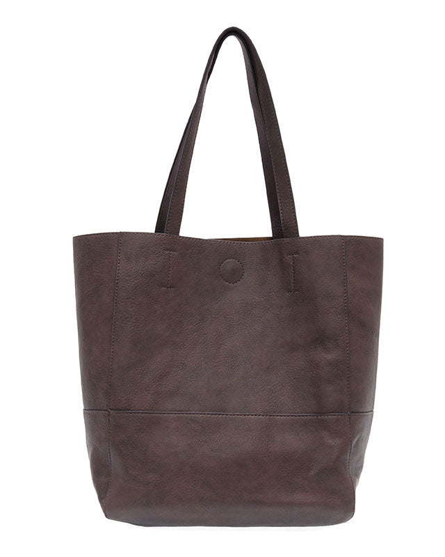Espresso vegan leather raw edge tote against a white background.