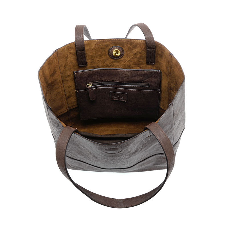 Espresso vegan leather raw edge tote opened against a white background.