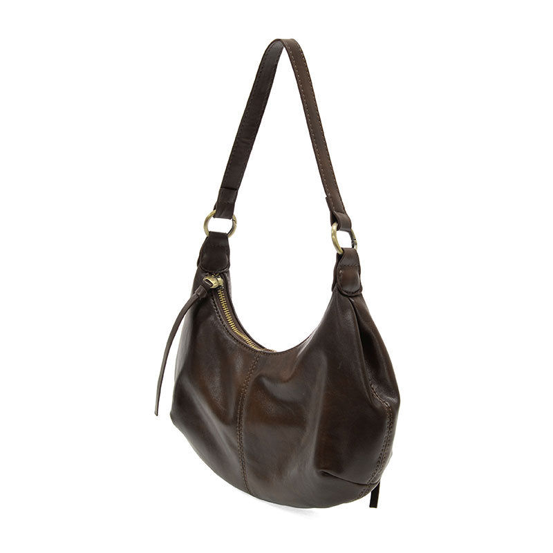 Mocha vegan leather shoulder bag with brass accents against a white background.