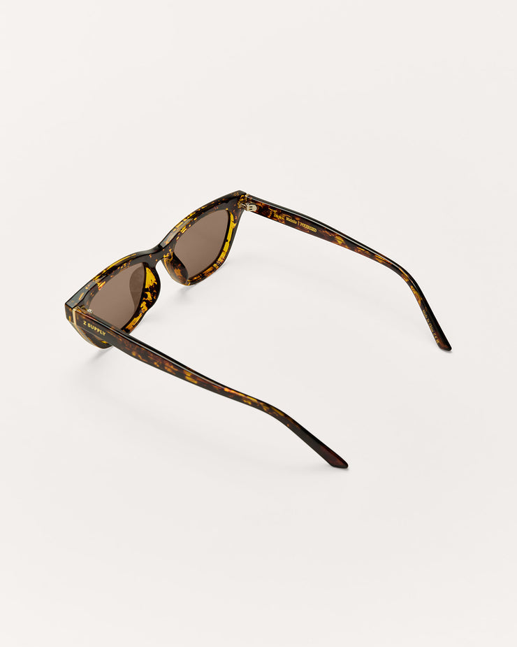 Black sunglasses with dark lenses on a white background