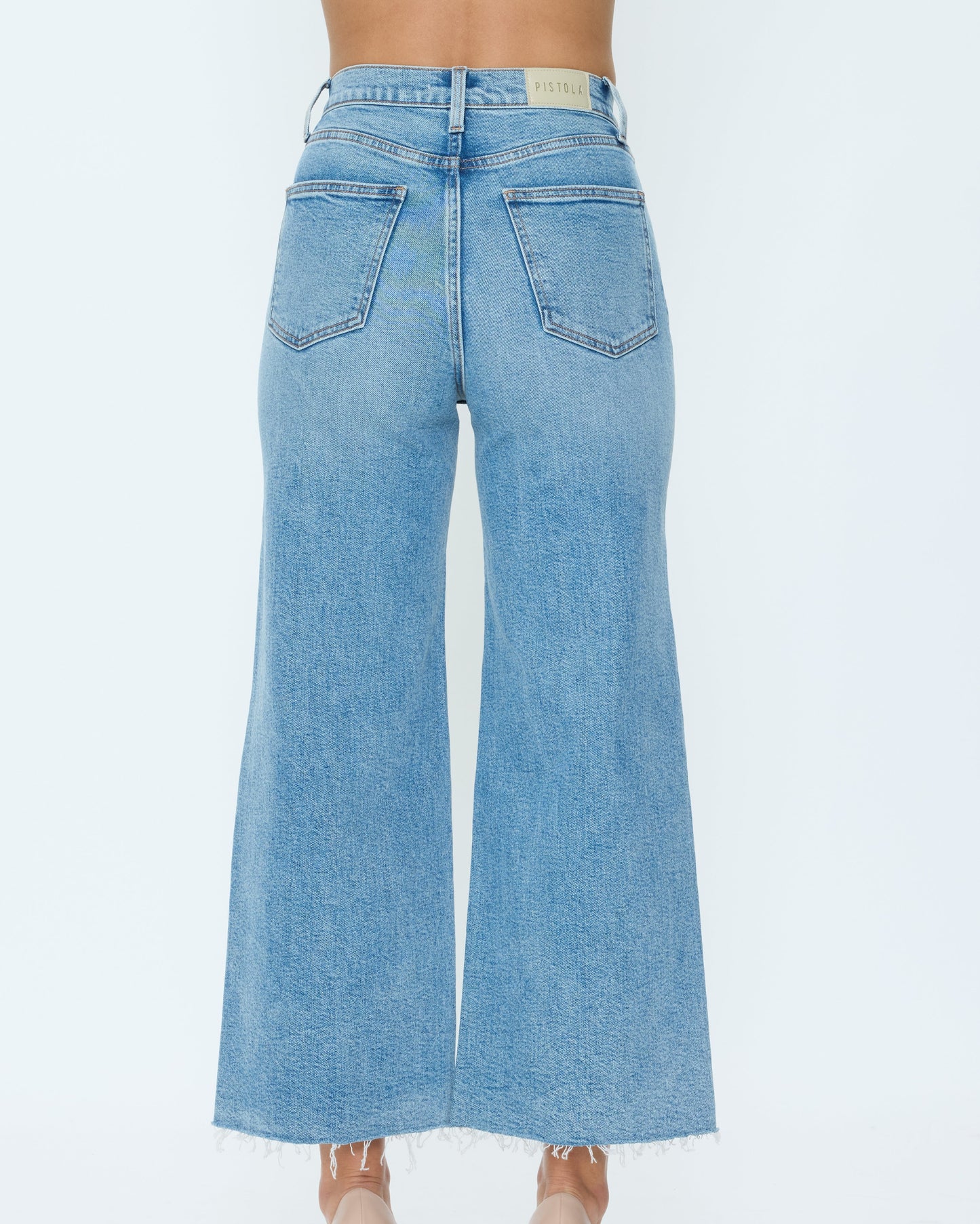 Light blue wide-leg jeans on a white background