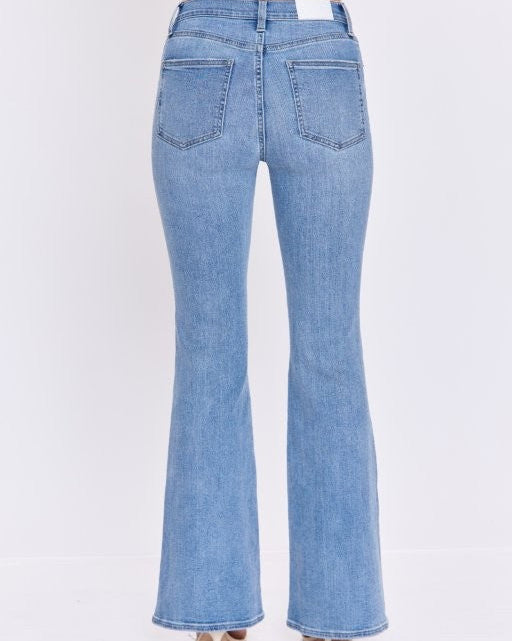 Light blue flared jeans on a white background
