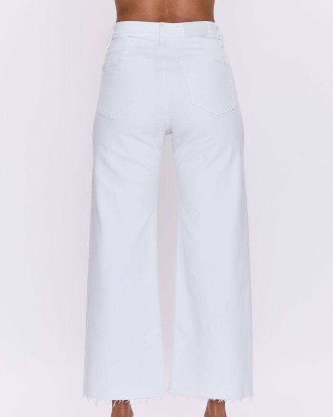White wide-leg pants worn by a person on a white background