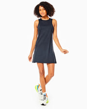 Model Wearing Addison Bay Black Panama Dress Wearing Sneakers On A White Background