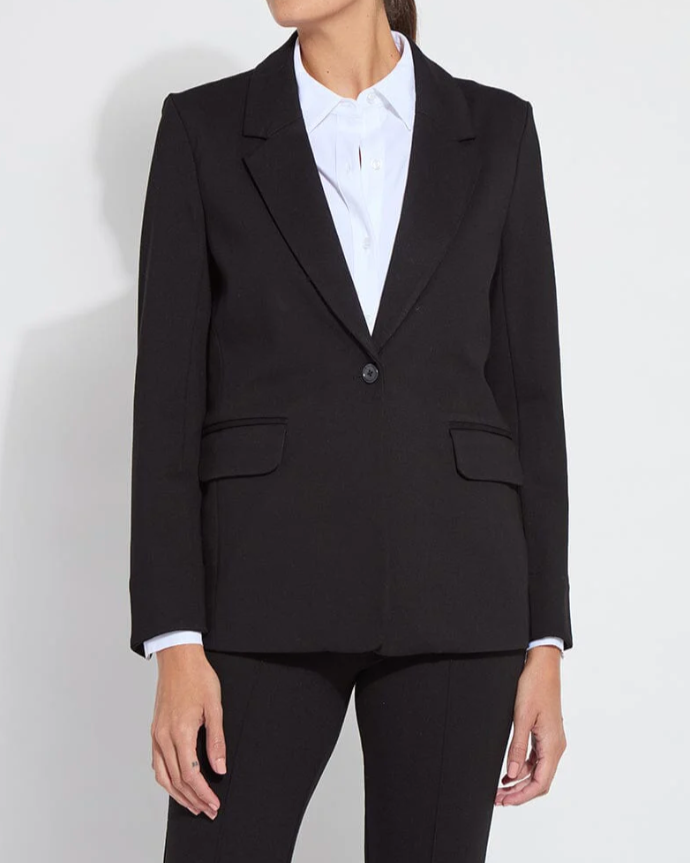 Person wearing a black suit jacket and pants on a white background