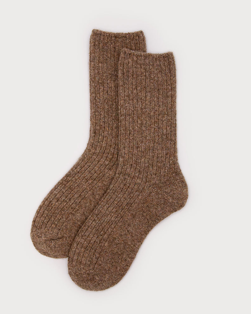 A pair of ribbed knit crew socks in a heathered brown color, displayed against a clean, light off-white background.