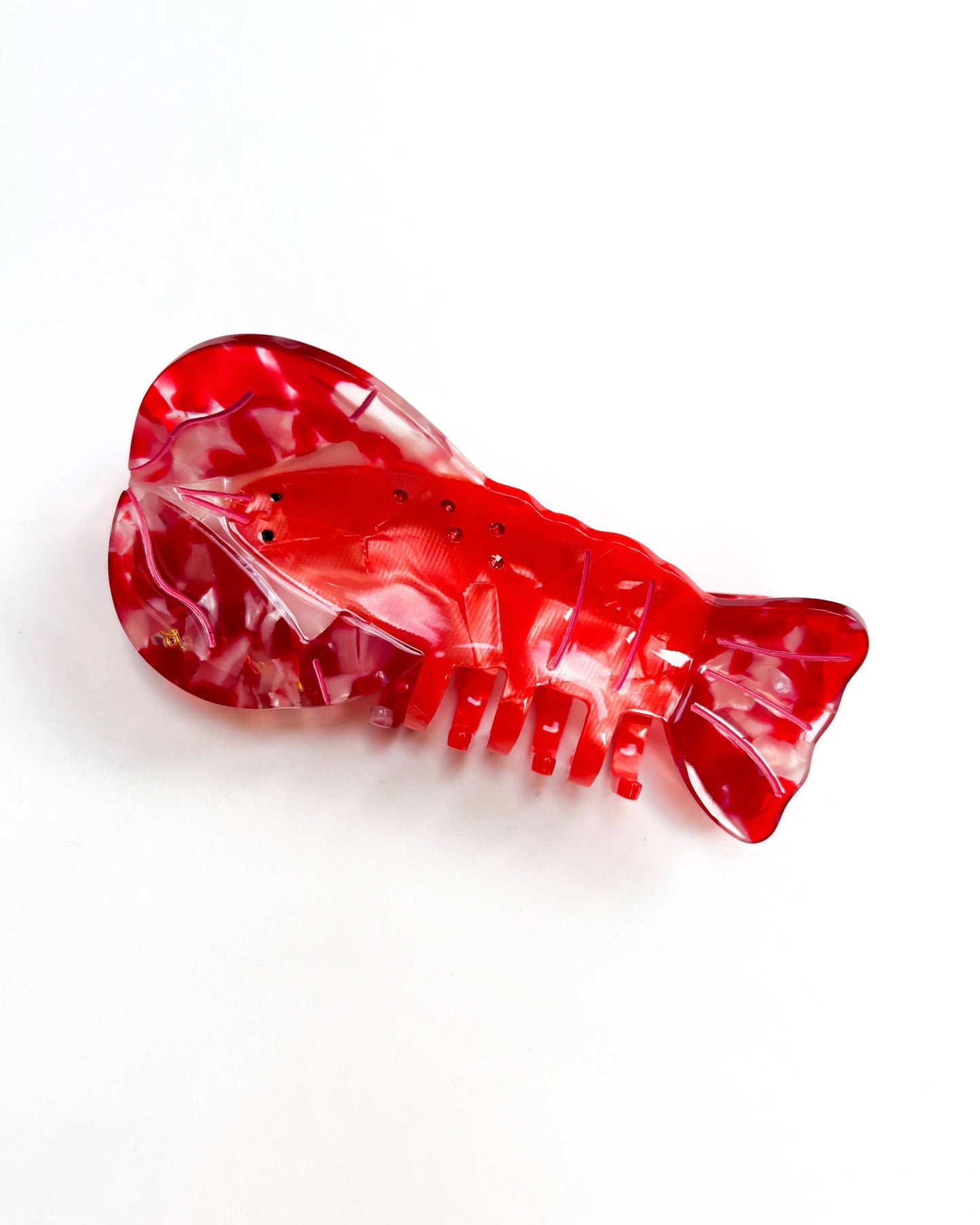 Red lobster-shaped clip on a white background