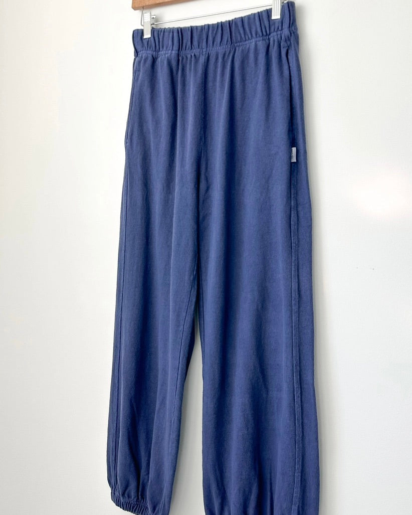 The Le Bon Shoppe balloon pant in midnight hanging against a white wall.