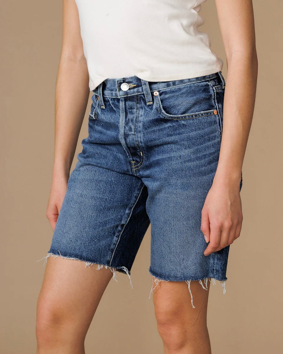 Front view of the Edwin sawyer bermuda shorts on a model wearing a white tee standing in front of a neutral backdrop