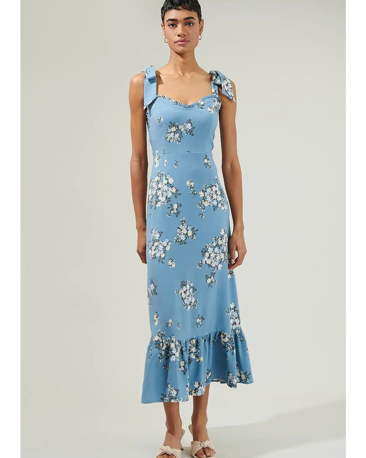 Model wearing Sugar Lips Floral Tie-Strap Slipdress on a gray background