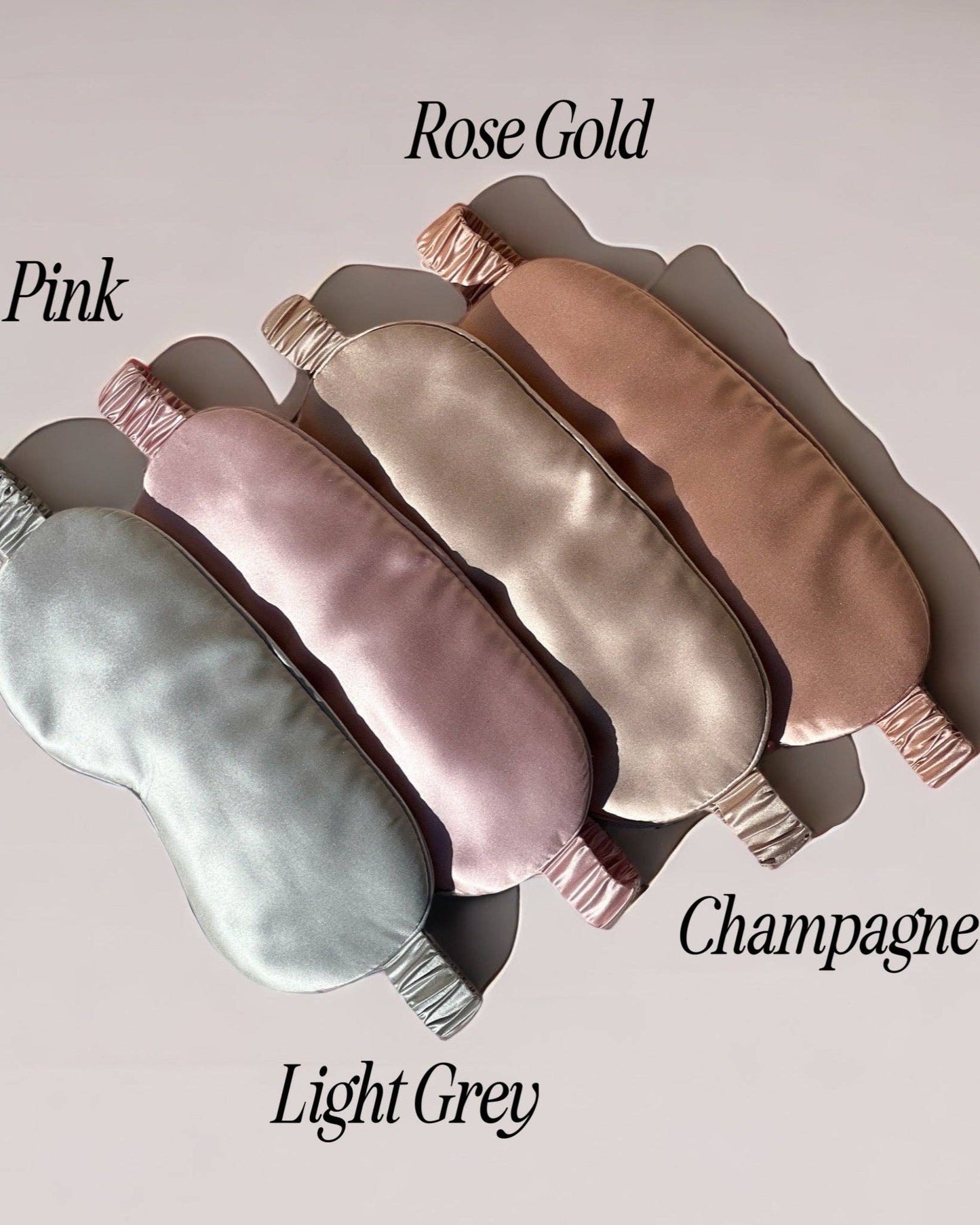 Set of the HoneyLux silk eye masks in various colors on a light background