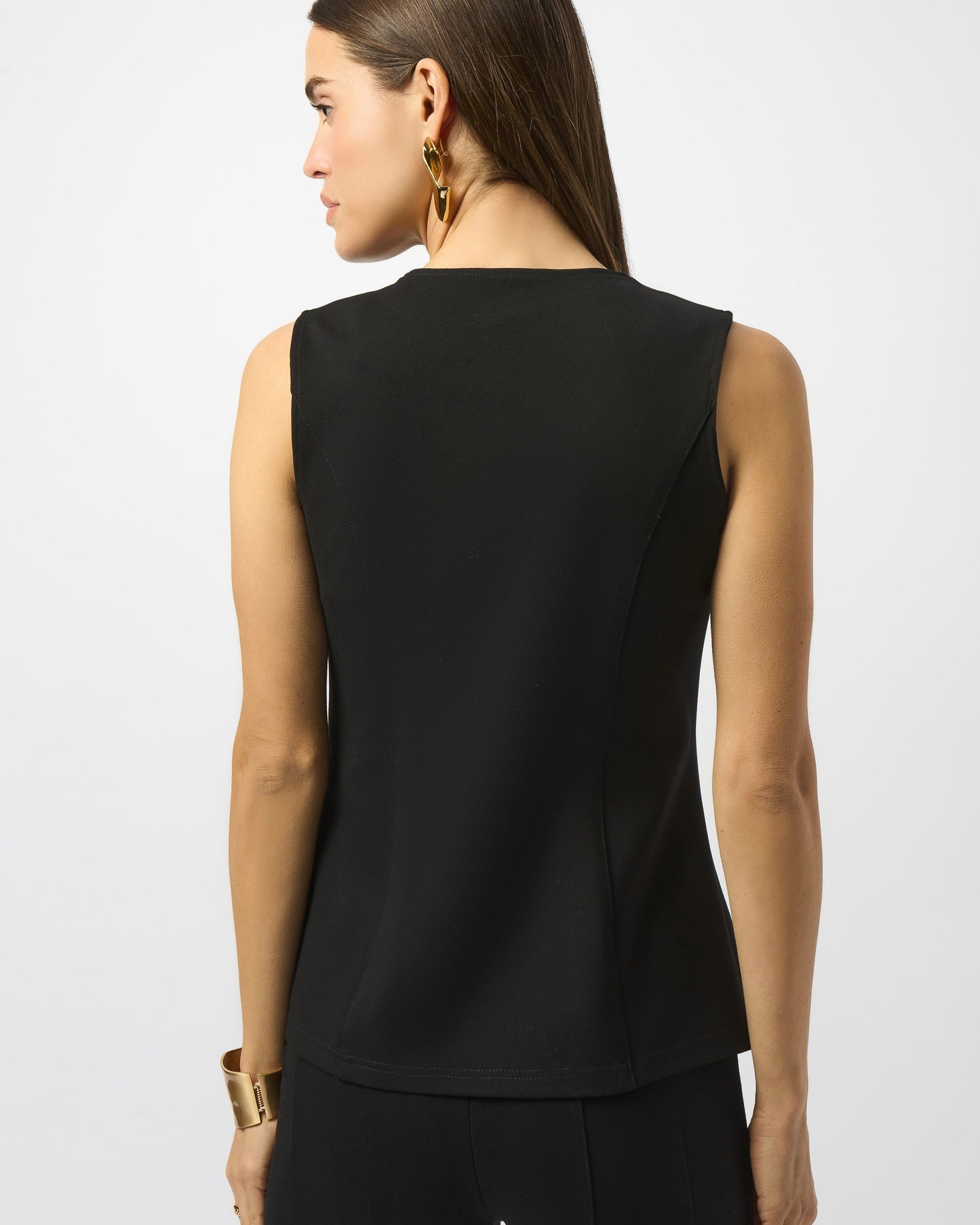 Model is wearing Joseph Ribkoff Heavy Knit Fitted Vest in black with black trousers on a white background