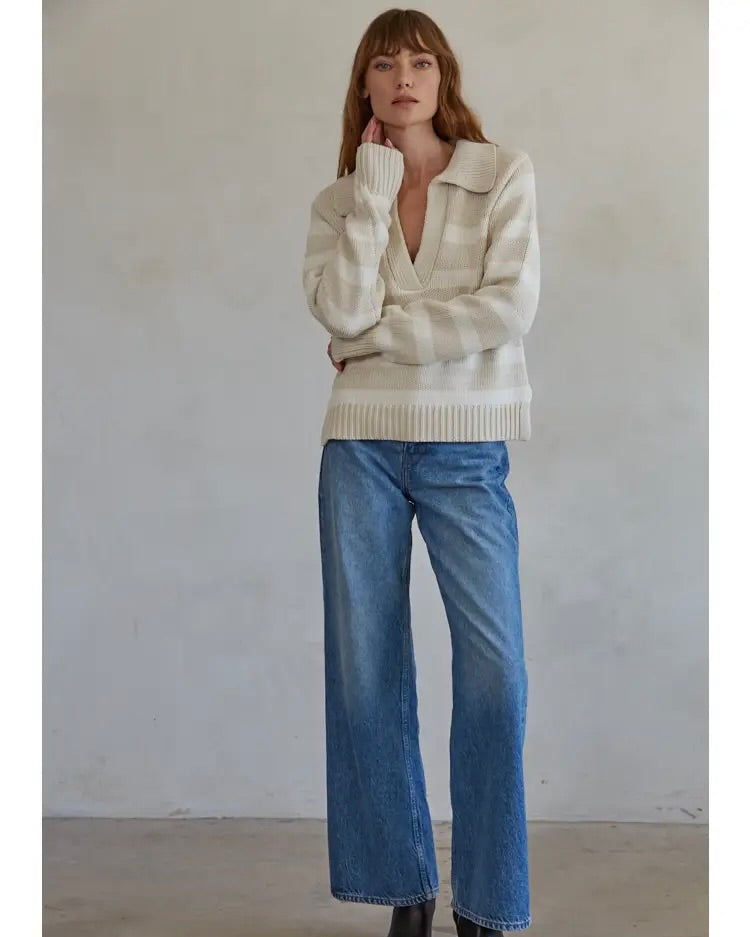 Model wearing By Together Chunky Polo Striped Sweater in white/sand wearing jeans on a white background