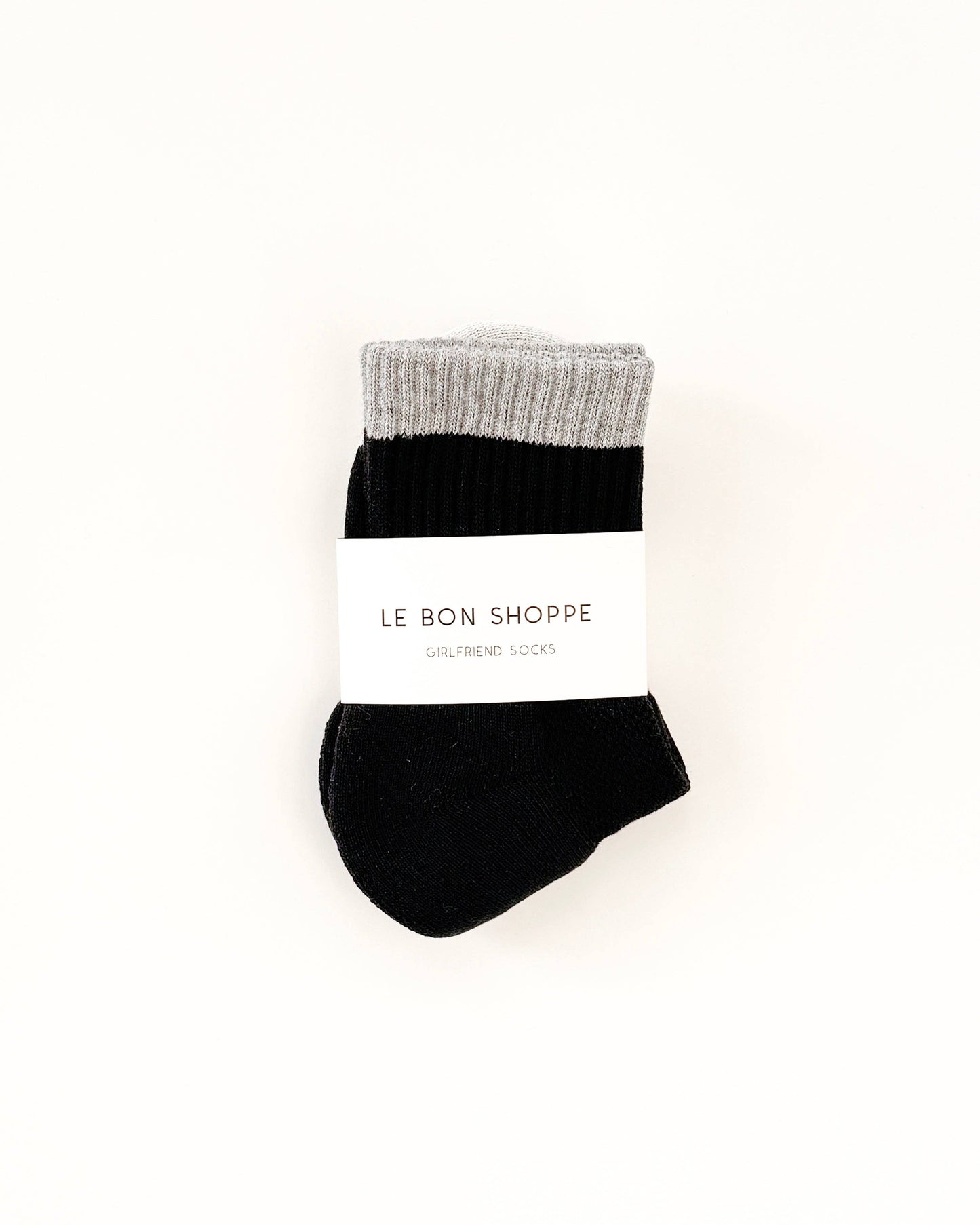 Black sock with gray top on a white background, featuring 'Le Bon Shoppe' branding.