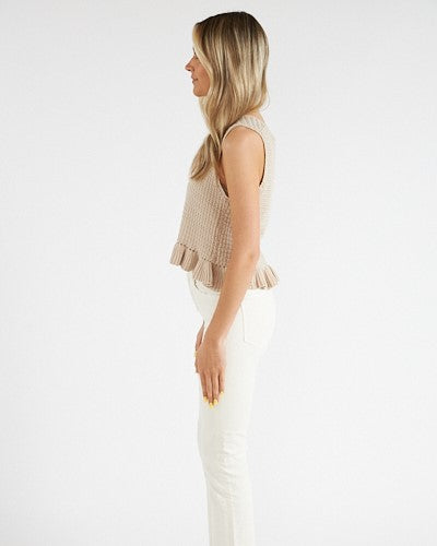 Model wearing Greylin Natural Fredi Crochet Tank wearing white pants on a white background