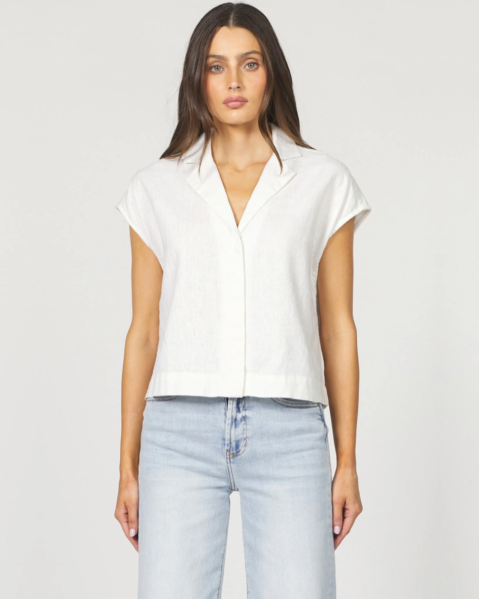 Front view of the Dear John Cruz shirt in white on a model wearing jeans standing in front of a white background