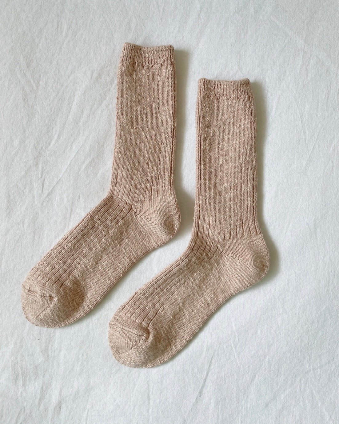 Le Bon Shoppe Cottage sock in color peachy keen on a white back ground