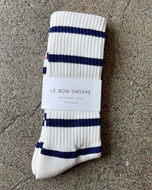 Image of LE BON SHOPPE extended striped boyfriend socks-sailor blue stripe on a brown background