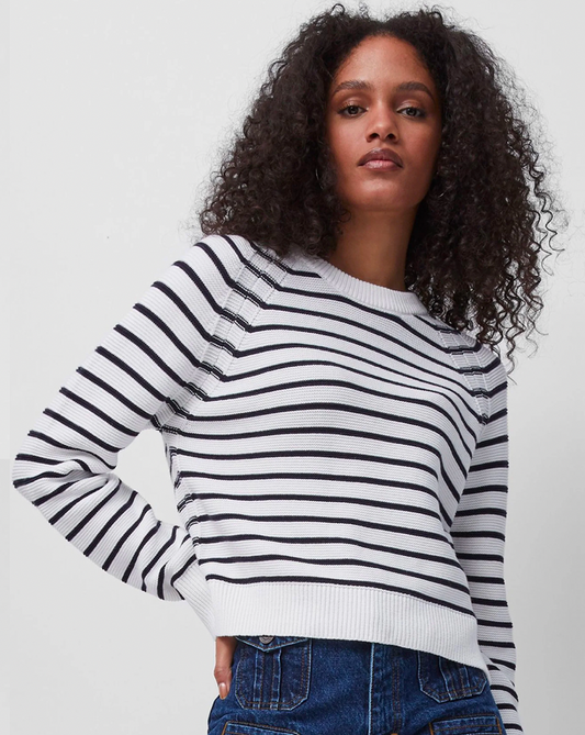 Model wearing French Connection Lillie Mozart Striped Sweater wearing jeans on a white background
