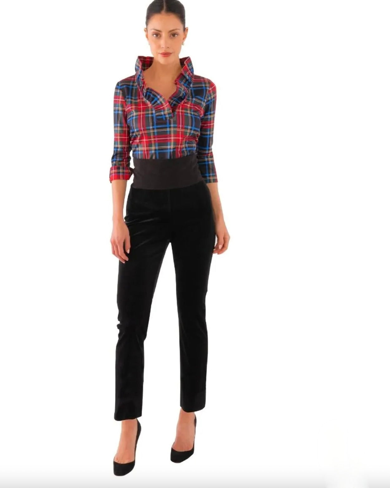 Model wearing Gretchen Scott Velvet Gripeless Pant wearing plaid shirt and black heels on a white background
