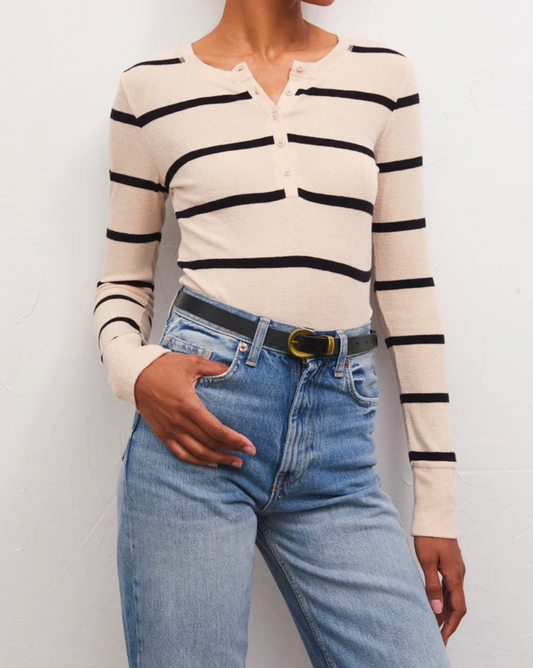Model wearing Z SUPPLY Scarlett Rib Henley shirt wearing jeans on a white background