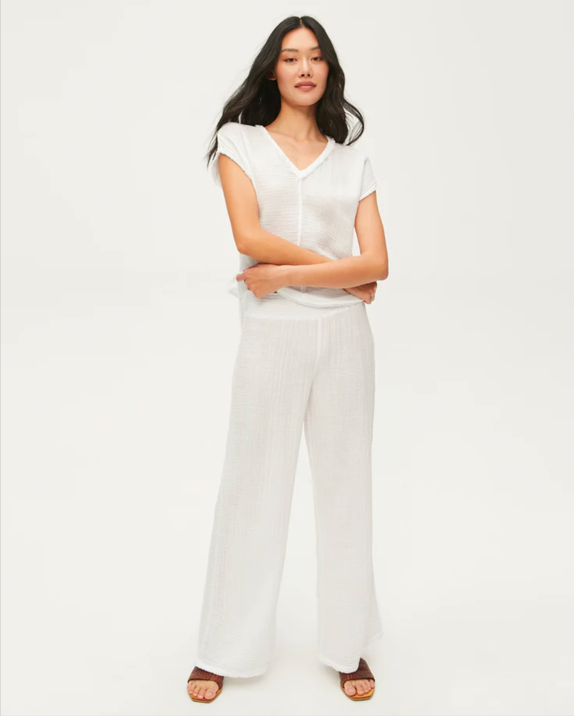 Model Wearing Michael Stars Susie Smocked Waist Pant In White Wearing White Top On A White Background