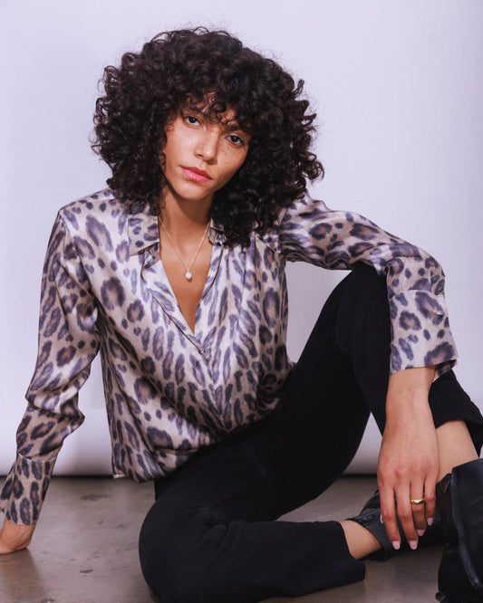 Model wearing the Catherinne Gee Daria blouse in New Leopard against a neutral background